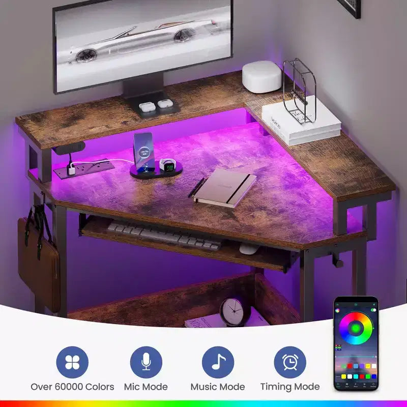 Escritorio esquinero pequeño Greenstell para computadora con toma de corriente, escritorio para computadora con luz LED, soporte para monitor, bandeja para teclado y soporte para auriculares