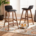 Baxton Studio 2 taburetes Darrin de piel sintética y madera negro/nogal/marrón: Asiento ovalado tapizado, altura fija de 76,2 cm